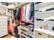 This walk-in closet features ample hanging space, drawers, shelves and shoe storage at 205 Stevenage Dr, Longwood, FL 32779