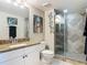 Bathroom featuring a granite countertop, sink, mirror, tiled shower, and toilet at 2055 S Atlantic Ave # 1410, Daytona Beach Shores, FL 32118