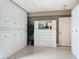 Bright bedroom with built-in storage, neutral walls, and tile flooring at 2055 S Atlantic Ave # 1410, Daytona Beach Shores, FL 32118