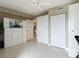 Large bedroom with built-in storage, neutral walls, and tile flooring at 2055 S Atlantic Ave # 1410, Daytona Beach Shores, FL 32118