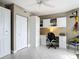 Functional home office with built-in storage, desk, and tile flooring at 2055 S Atlantic Ave # 1410, Daytona Beach Shores, FL 32118