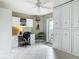Bright home office with custom built-ins, desk area, and tile flooring at 2055 S Atlantic Ave # 1410, Daytona Beach Shores, FL 32118