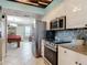Well-equipped kitchen featuring stainless steel appliances and tile flooring at 2055 S Atlantic Ave # 1410, Daytona Beach Shores, FL 32118