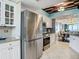 This kitchen has white cabinets, stainless steel appliances, and tile backsplash at 2055 S Atlantic Ave # 1410, Daytona Beach Shores, FL 32118