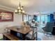 Inviting dining and living room with ocean view, stylish furniture, and decor at 2055 S Atlantic Ave # 1410, Daytona Beach Shores, FL 32118