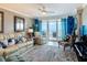 Bright living room with ample seating, ocean views, and stylish decor at 2055 S Atlantic Ave # 1410, Daytona Beach Shores, FL 32118