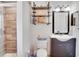 Updated bathroom with tiled shower, dark vanity, and stylish decorative accents and finishes at 2406 Sweetwater Blvd, St Cloud, FL 34772