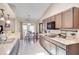 Bright eat-in kitchen featuring sleek appliances, granite countertops, and ample cabinet space at 2406 Sweetwater Blvd, St Cloud, FL 34772