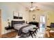 Stylish bedroom with a statement ceiling fan, a spacious layout, and modern furnishings at 2406 Sweetwater Blvd, St Cloud, FL 34772