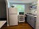 Well-lit kitchen with modern appliances, gray cabinetry, and ample counter space, designed for efficient cooking and meal preparation at 2515 Marlboro St, Orlando, FL 32806