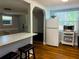 Efficient kitchen layout with breakfast bar, refrigerator, and microwave, providing functionality and convenience for everyday use at 2515 Marlboro St, Orlando, FL 32806