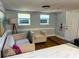 Bright living room featuring comfortable seating, natural lighting, and hardwood floors, perfect for relaxing and entertaining at 2515 Marlboro St, Orlando, FL 32806