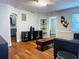 Inviting living room with hardwood floors, arched doorways, and stylish decor at 2515 Marlboro St, Orlando, FL 32806