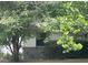 This single-story home has a stone accent and is surrounded by greenery at 2645 Ne 44Th St, Ocala, FL 34479