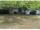 A quaint single-story home features a well-maintained front lawn and attached garage at 2645 Ne 44Th St, Ocala, FL 34479