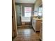 Bathroom with modern shower, a built-in tub and dual sinks with wood tile flooring at 2817 Moultrie Creek Dr, Kissimmee, FL 34743