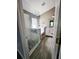 Modern bathroom featuring a glass shower with black and white tile and a vanity with a white cabinet at 2817 Moultrie Creek Dr, Kissimmee, FL 34743