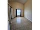 Empty bedroom with tile floors features a ceiling fan and window at 2817 Moultrie Creek Dr, Kissimmee, FL 34743
