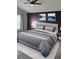 Comfortable bedroom featuring neutral tones, a ceiling fan, and tasteful artwork at 2817 Moultrie Creek Dr, Kissimmee, FL 34743
