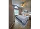 Comfortable bedroom featuring neutral tones, a ceiling fan, and an arched window at 2817 Moultrie Creek Dr, Kissimmee, FL 34743