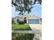 Charming single-Gathering home features a well-maintained lawn, inviting entryway, and a convenient two-car garage at 2817 Moultrie Creek Dr, Kissimmee, FL 34743