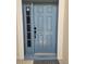 Stylish front door with sidelight offers a warm welcome to this inviting home at 2817 Moultrie Creek Dr, Kissimmee, FL 34743