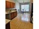 Functional kitchen featuring updated countertops, tile floors, and stainless steel appliances at 2817 Moultrie Creek Dr, Kissimmee, FL 34743