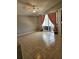 Open-concept living space boasts neutral colors, tile floors, large sliding glass doors, and ceiling fan at 2817 Moultrie Creek Dr, Kissimmee, FL 34743