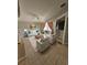 Bright living room with tile floors, a ceiling fan, comfortable seating, and sliding door access to lanai at 2817 Moultrie Creek Dr, Kissimmee, FL 34743