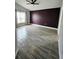 Spacious main bedroom features hardwood floors, a ceiling fan, and windows for natural light at 2817 Moultrie Creek Dr, Kissimmee, FL 34743