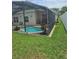 A screened in pool provides a private outdoor retreat within the home's backyard at 2817 Moultrie Creek Dr, Kissimmee, FL 34743