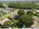 Aerial view of home and neighborhood, showcasing its landscaping and location at 303 Mariana Way, Kissimmee, FL 34758