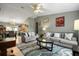 Bright and open living area with views into the adjacent dining and kitchen spaces at 303 Mariana Way, Kissimmee, FL 34758
