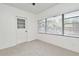 Finished bedroom featuring carpet with natural light from window and access door at 3519 Amigos Ave, Orlando, FL 32808
