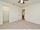 Bright bedroom with neutral carpet, closet and ample natural light at 3519 Amigos Ave, Orlando, FL 32808