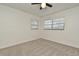 Bright bedroom featuring neutral carpet, a ceiling fan, and two windows for natural light at 3519 Amigos Ave, Orlando, FL 32808