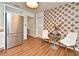 Bright kitchen with stainless steel appliances, stylish cabinetry, and decorative star wallpaper at 3519 Amigos Ave, Orlando, FL 32808