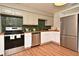 Functional kitchen featuring sleek stainless steel appliances, modern cabinetry, and attractive tile backsplash, designed for efficient cooking at 3519 Amigos Ave, Orlando, FL 32808