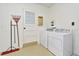 Functional laundry room with washer, dryer, and exterior access at 3519 Amigos Ave, Orlando, FL 32808