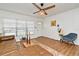 Well-lit living room featuring a plush leather sofa, stylish rug, and abundant natural light, creating a cozy atmosphere at 3519 Amigos Ave, Orlando, FL 32808