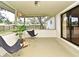 This screened patio offers a comfortable space, blending indoor and outdoor living at 3519 Amigos Ave, Orlando, FL 32808