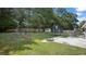 The property boasts a spacious backyard with recreational equipment at 3565 Sw Idlewild St, Dunnellon, FL 34431