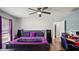 Bright bedroom featuring a comfortable bed, open closet, and workspace at 3565 Sw Idlewild St, Dunnellon, FL 34431