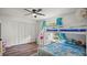 Bright bedroom featuring a bunk bed, large closet, and light wood floors at 3565 Sw Idlewild St, Dunnellon, FL 34431
