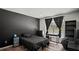 Monochrome bedroom featuring a comfy bed, closet, and bright window at 3565 Sw Idlewild St, Dunnellon, FL 34431