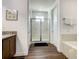 Bathroom featuring a glass shower, bathtub, and tile floors at 370 Pendant Ct, Kissimmee, FL 34747