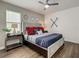 Bedroom featuring nautical decor, a decorative headboard, and a ceiling fan at 370 Pendant Ct, Kissimmee, FL 34747