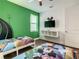 A bedroom is decorated with bright colors and themed bedding, creating a fun and playful atmosphere at 370 Pendant Ct, Kissimmee, FL 34747