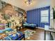 A bedroom is decorated with bright colors and themed bedding, creating a fun and playful atmosphere at 370 Pendant Ct, Kissimmee, FL 34747