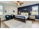 Bedroom with king bed, bedside tables, lamps, and sitting area at 370 Pendant Ct, Kissimmee, FL 34747